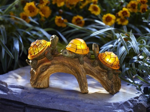 LED solar powered turtle on a log
